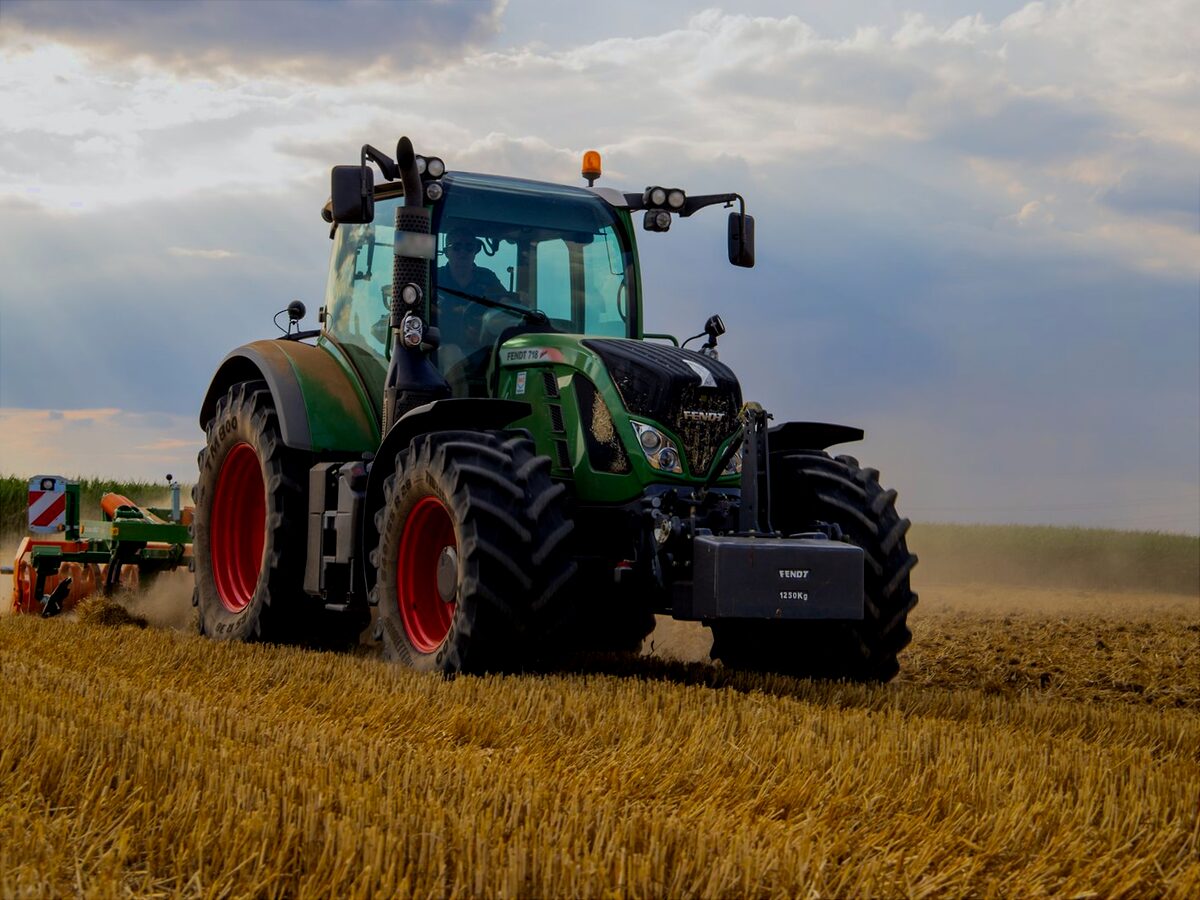 Green Fendt tractor working a stubble field